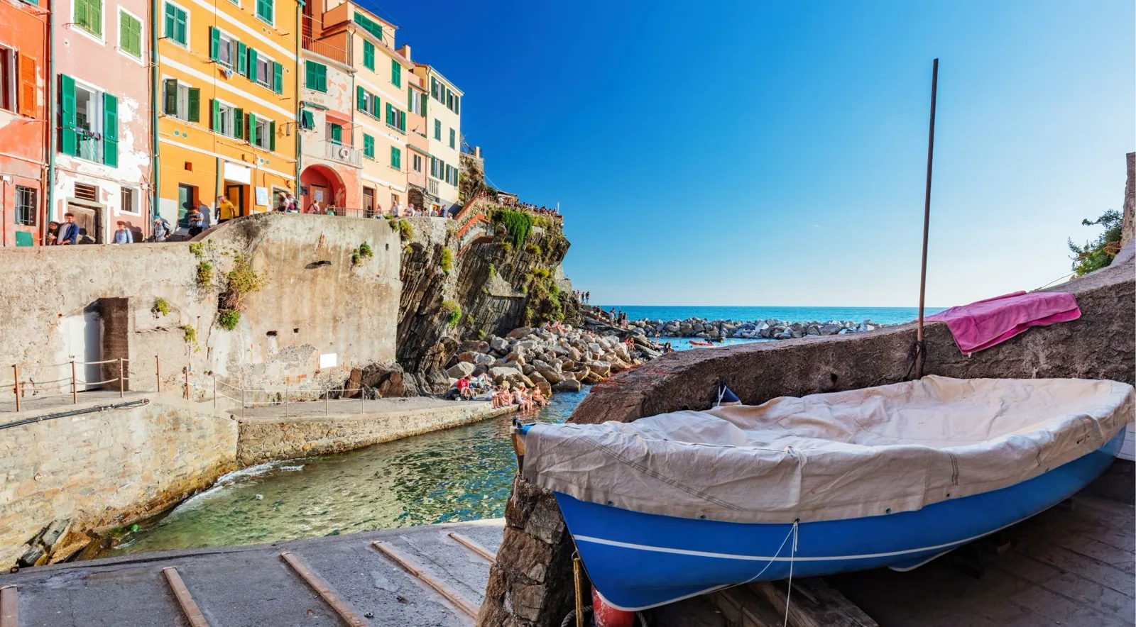 Traditional fishing boats moored in Riomaggiore harbour — Cinque Terre, Liguria